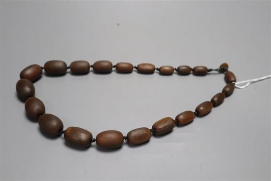 A rhinoceros horn graduated bead necklace, late 19th/early 20th century, length 55cm